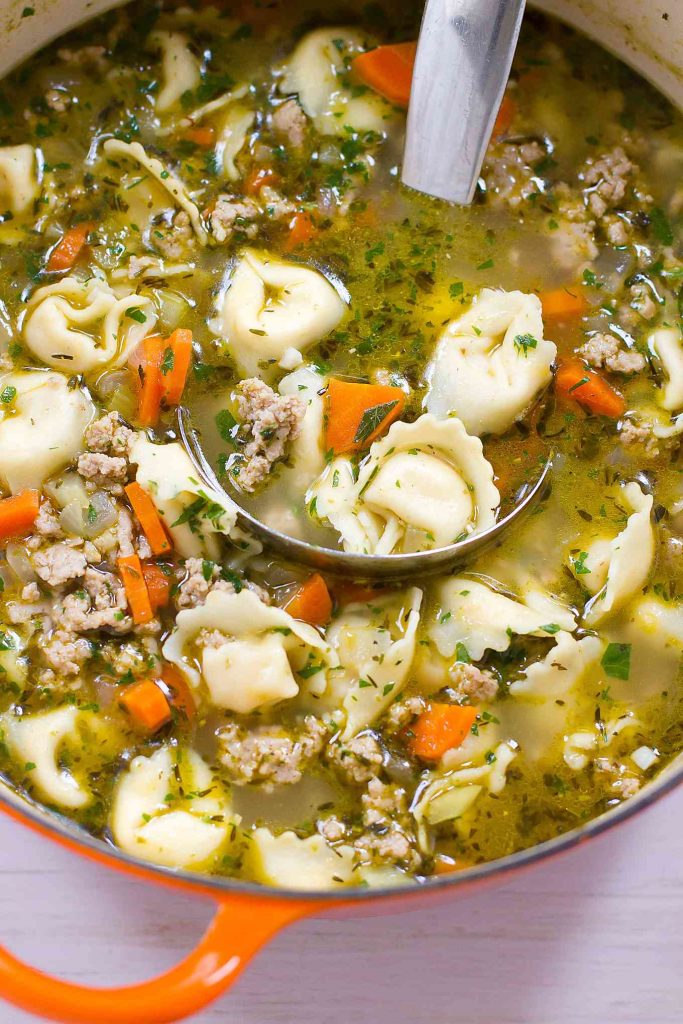 You can never have enough 30 minute recipes! This healthy Pesto Turkey Tortellini Soup recipe makes weeknight cooking easy. 230 calories and 4 Weight Watchers SP | Ground Turkey | Stovetop | Easy | Healthy | 30 Minute Meal | Recipes | Broth #tortellinisoup #30minutemeals #easydinnerrecipes #souprecipes #healthysoups #weightwatchers #smartpoints