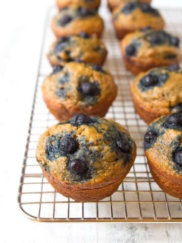 Banana blueberry muffins on a wire rack