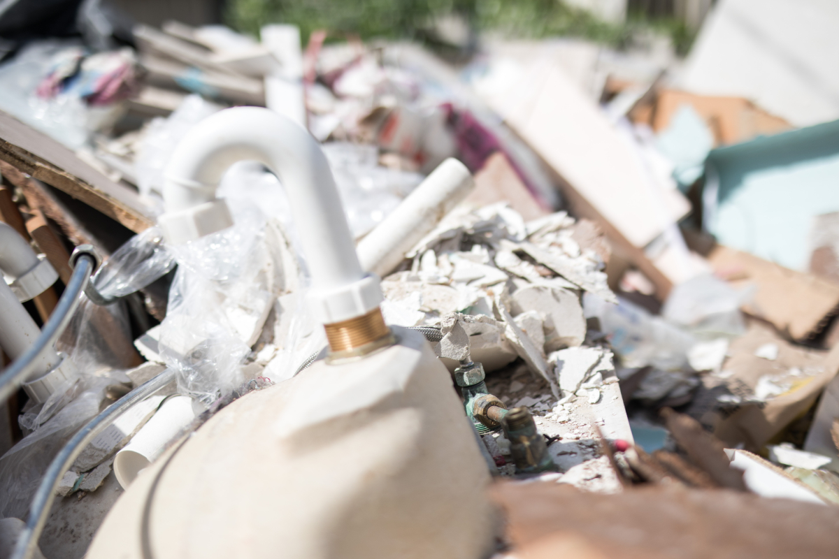 Old bathroom suite in a skip