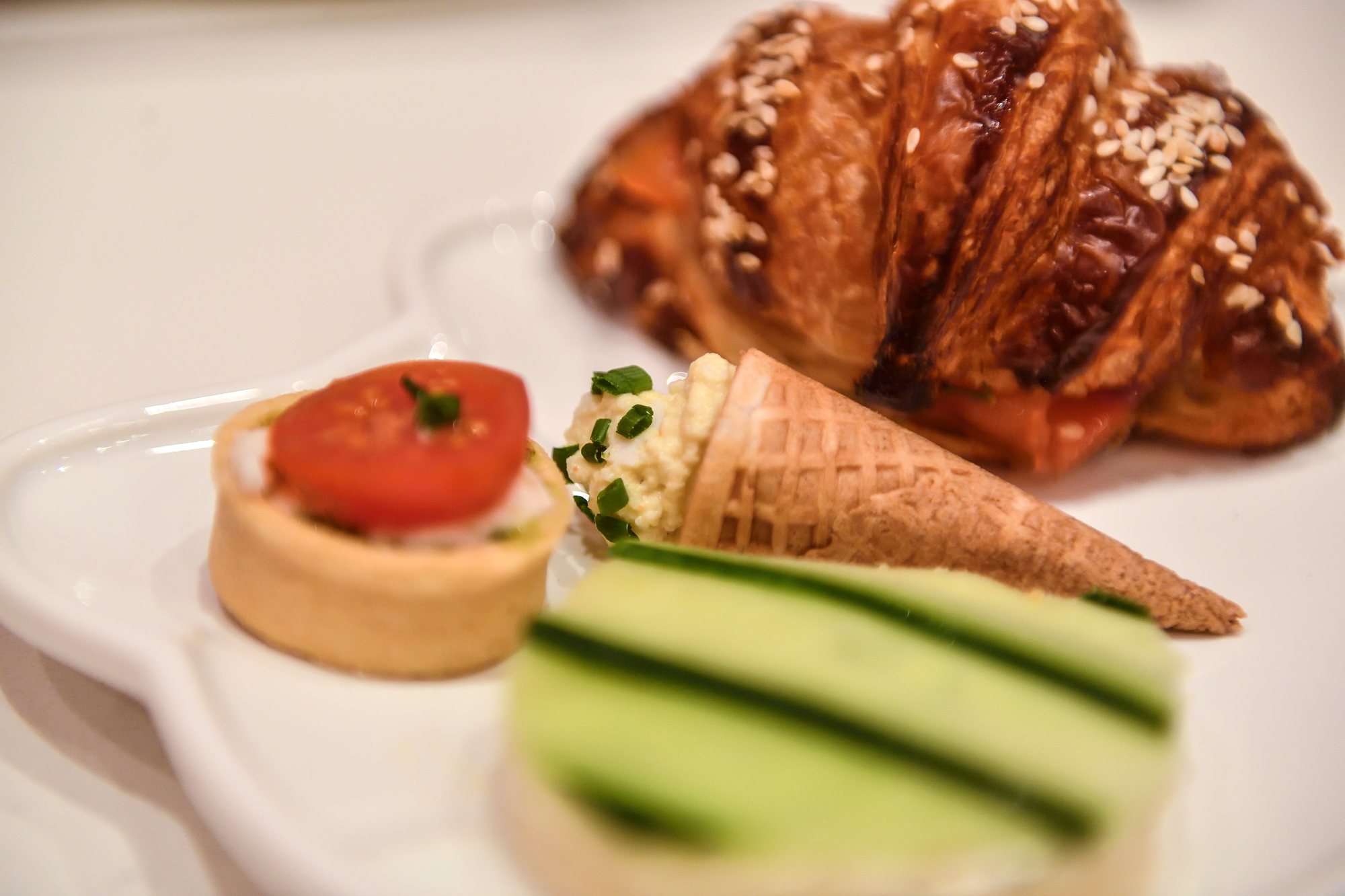 Cucumber with dill cream cheese on milk bread, creamy egg salad with chives and paprika in a savory cone, mozzarella with vine tomatoes and pesto in a tart shell and smoked salmon and dill cream cheese on a pretzel croissant are part of the daytime traditional Afternoon Tea service in the Bow Room at the Hello Kitty Grand Cafe at the Irvine Spectrum in Irvine, CA, on Thursday, Sep 13, 2018. (Photo by Jeff Gritchen, Orange County Register/SCNG)