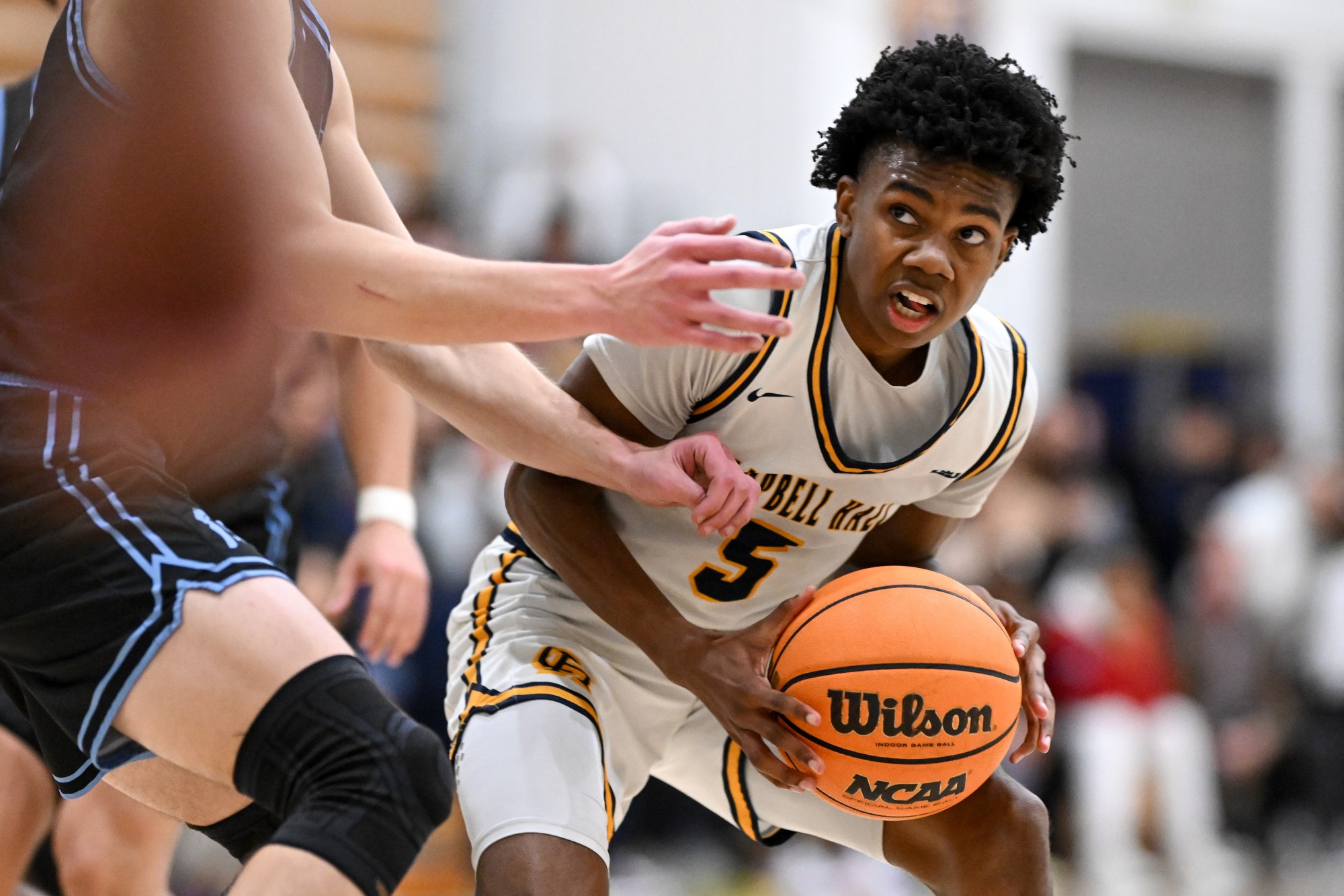 Campbell Hall's Isaiah Johnson, #5, looks for a opening for a shot during third period action in the second round of the CIF Southern Section Division 2AA playoffs at Campbell Hall on Friday, Feb. 9, 2024.  Campbell Hall defeated Saugus 83-63.  (Photo by David Crane, Los Angeles Daily News/SCNG)