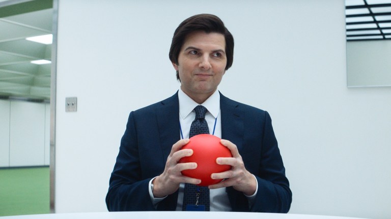 Mark S (Adam Scott) smiles and holds a red ball in Severance season 2.