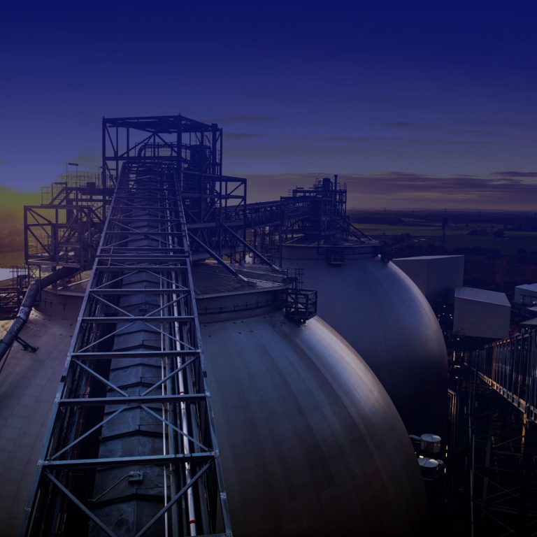 Sunset behind biomass storage domes at Drax Power Station in North Yorkshire