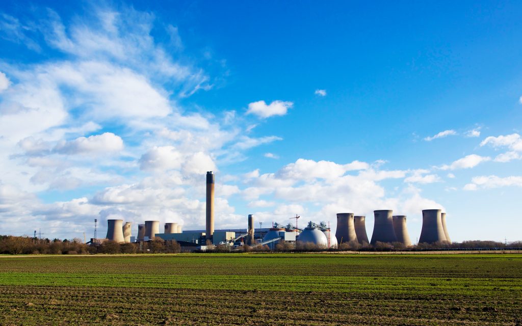 Drax Power Station with biomass domes on a blue sky day