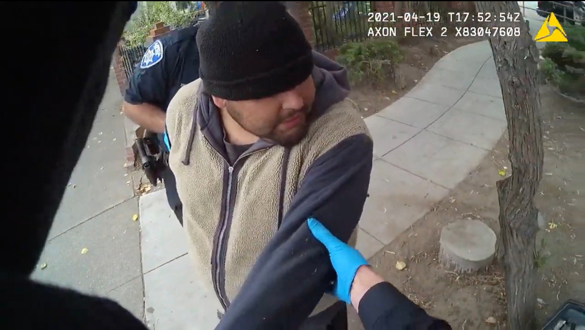 Mario Gonzalez is restrained by Alameda police officers on April 19 in a video from an officer's body-worn camera. (Alameda Police Department)