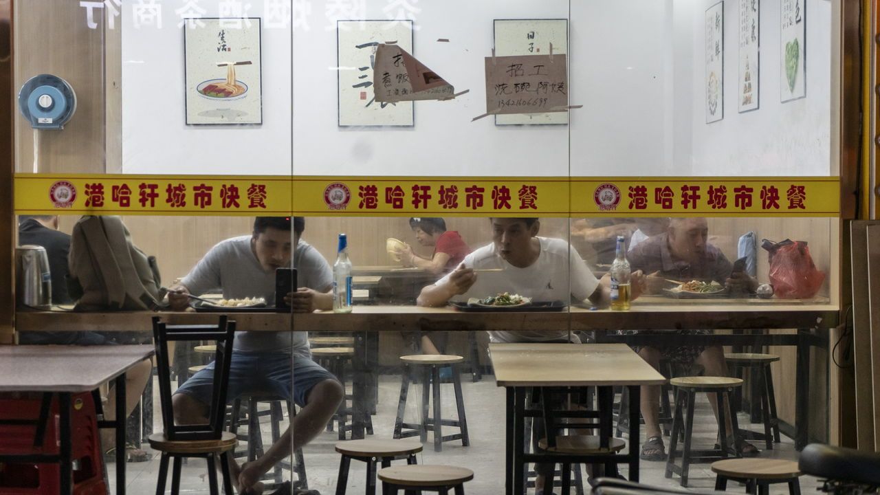 Customers dine at a restaurant in Guangzhou, China