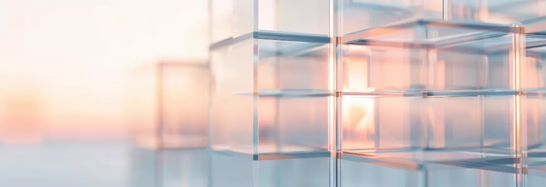 Glass structure with sunset light in the background