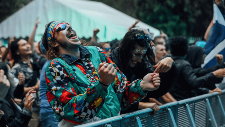 Fans at a music concert cheering