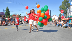 People with balloons at fundraiser