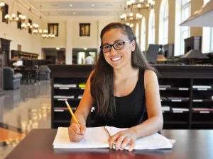 girl with study skills in library