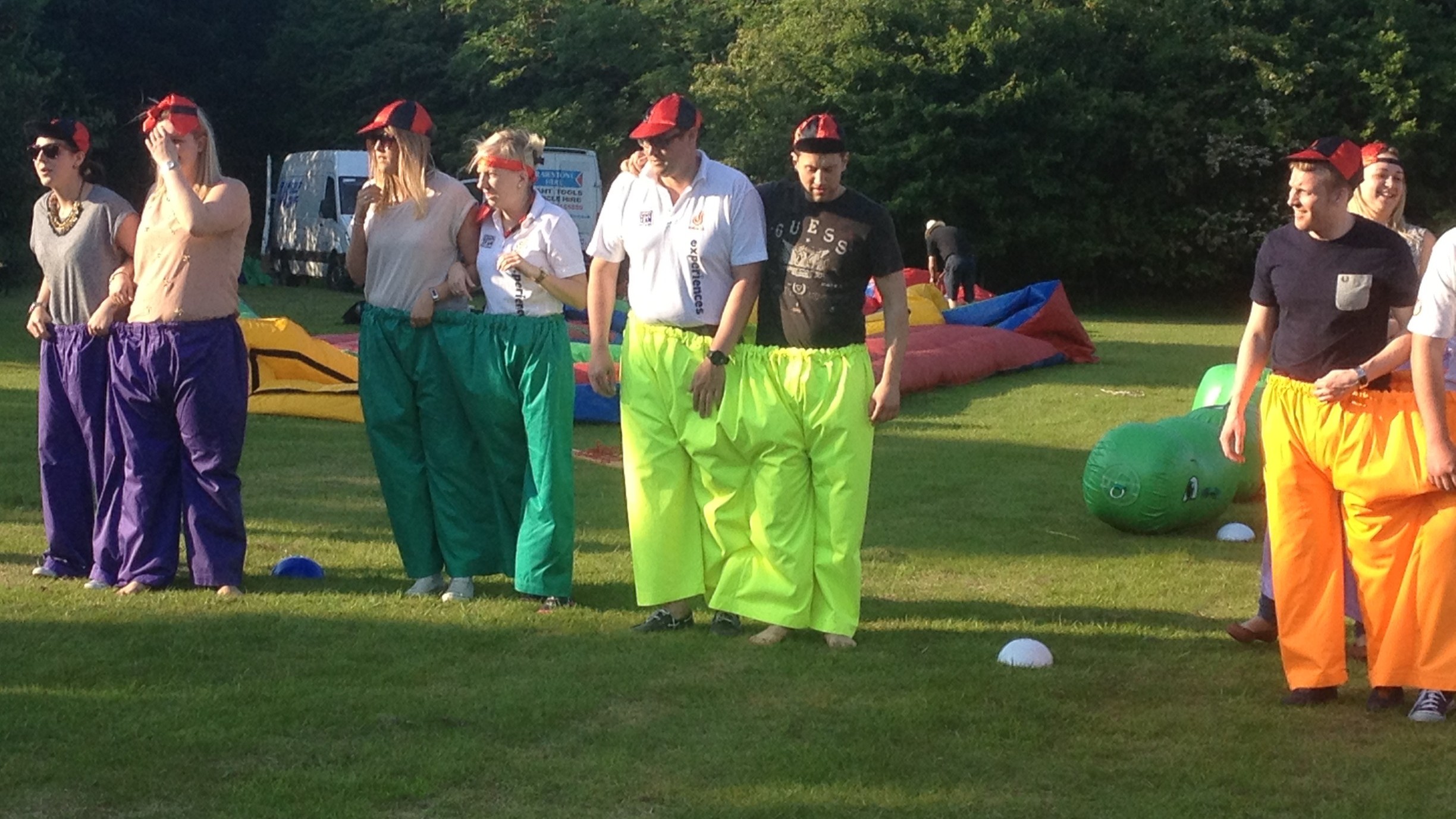 teams competing in 3-legged race in company sports day