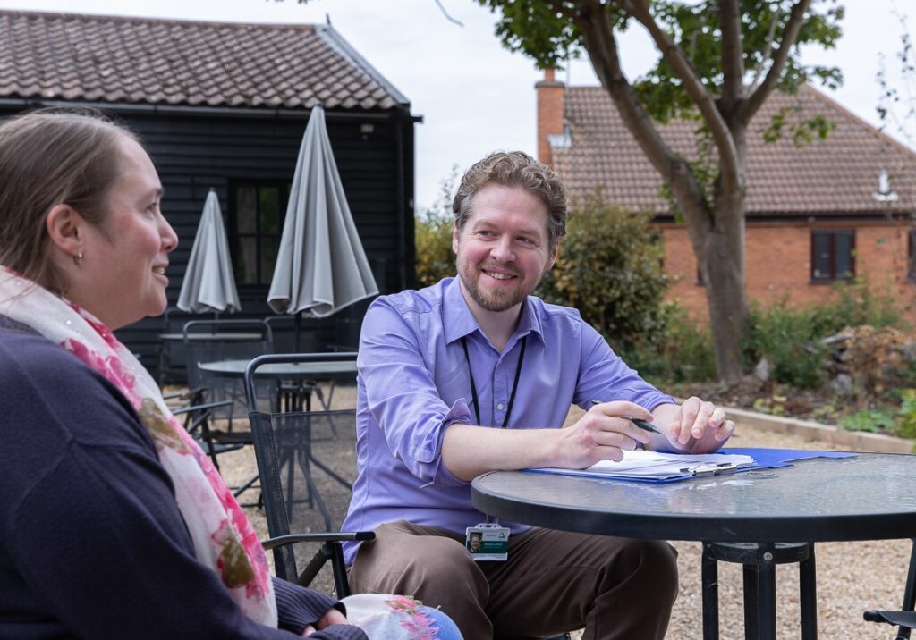 Business owner chatting with Groundwork Sustainabiilty Consultant