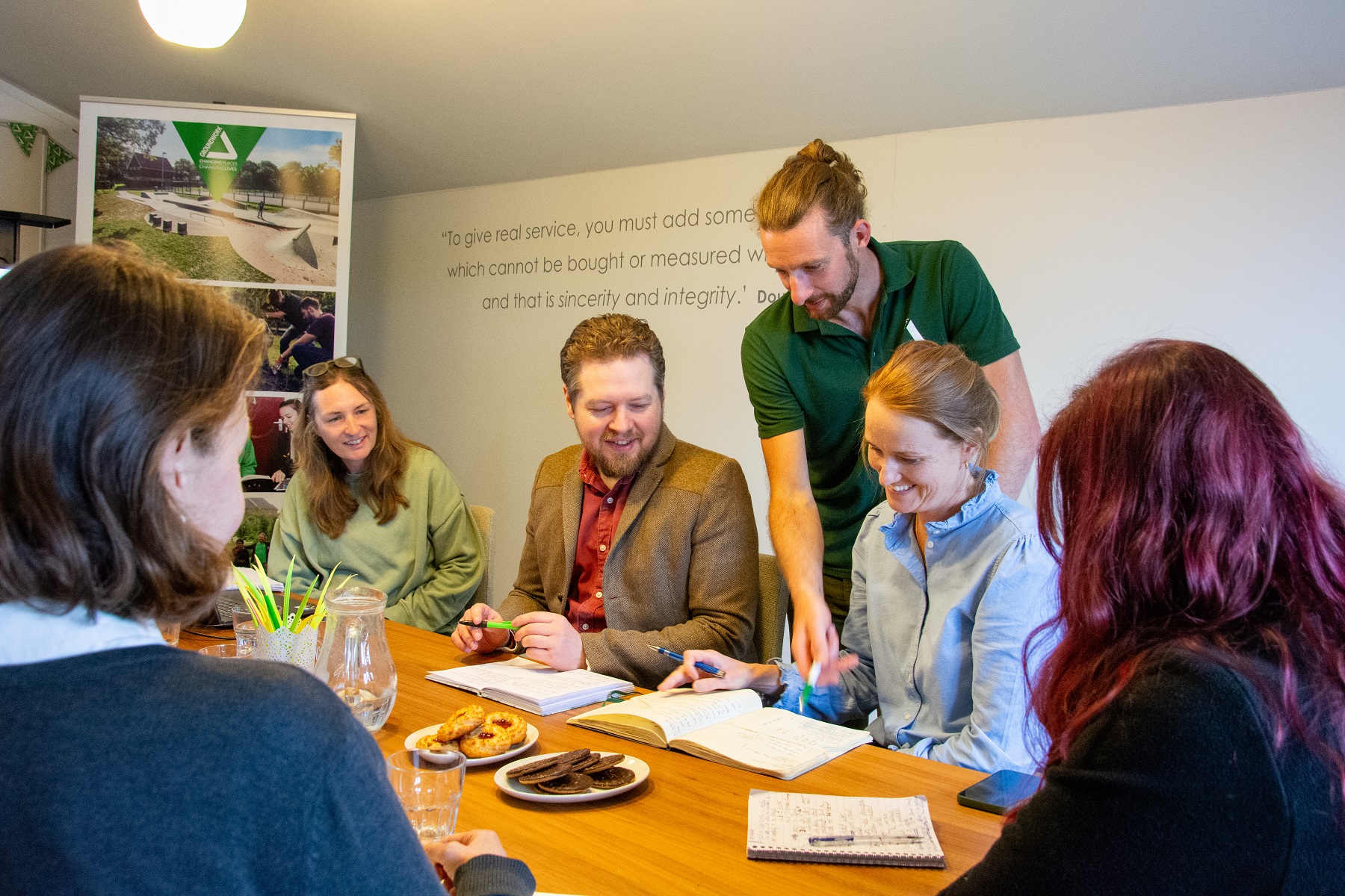 People round a table in a study environment