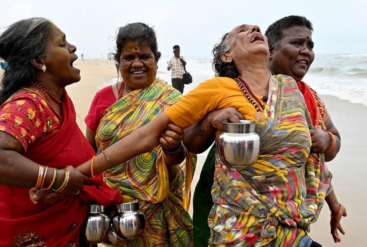 A woman is consoled as she cries during a prayer ceremony for the victims of the 2004 Indian Ocean Tsunami on the 20th anniversary of the disaster, at Pattinapakkam beach in Chennai, India, on Dec. 26, 2024. 