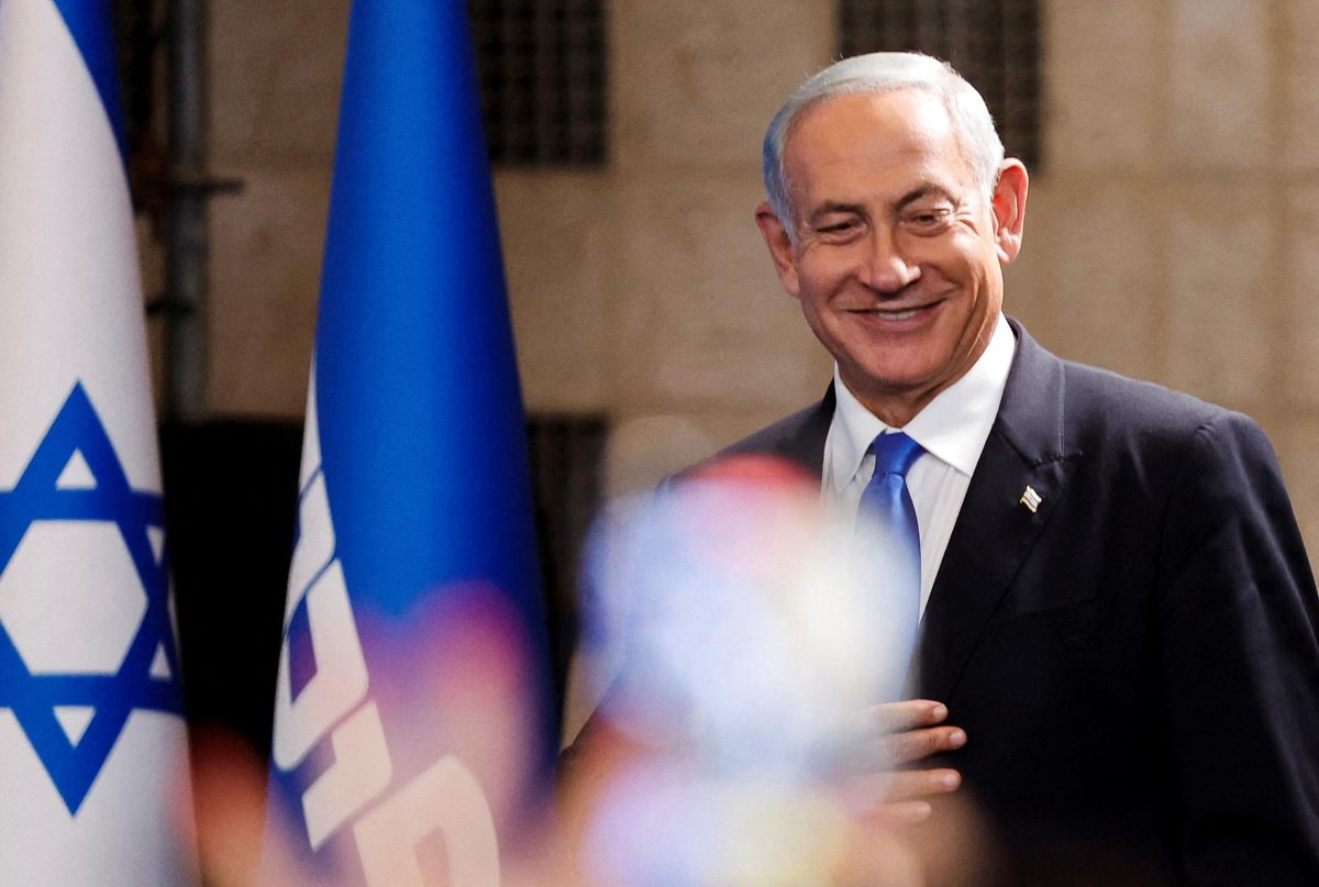 Likud Party leader Benjamin Netanyahu walks to address his supporters at his party headquarters during Israel's general election in Jerusalem.