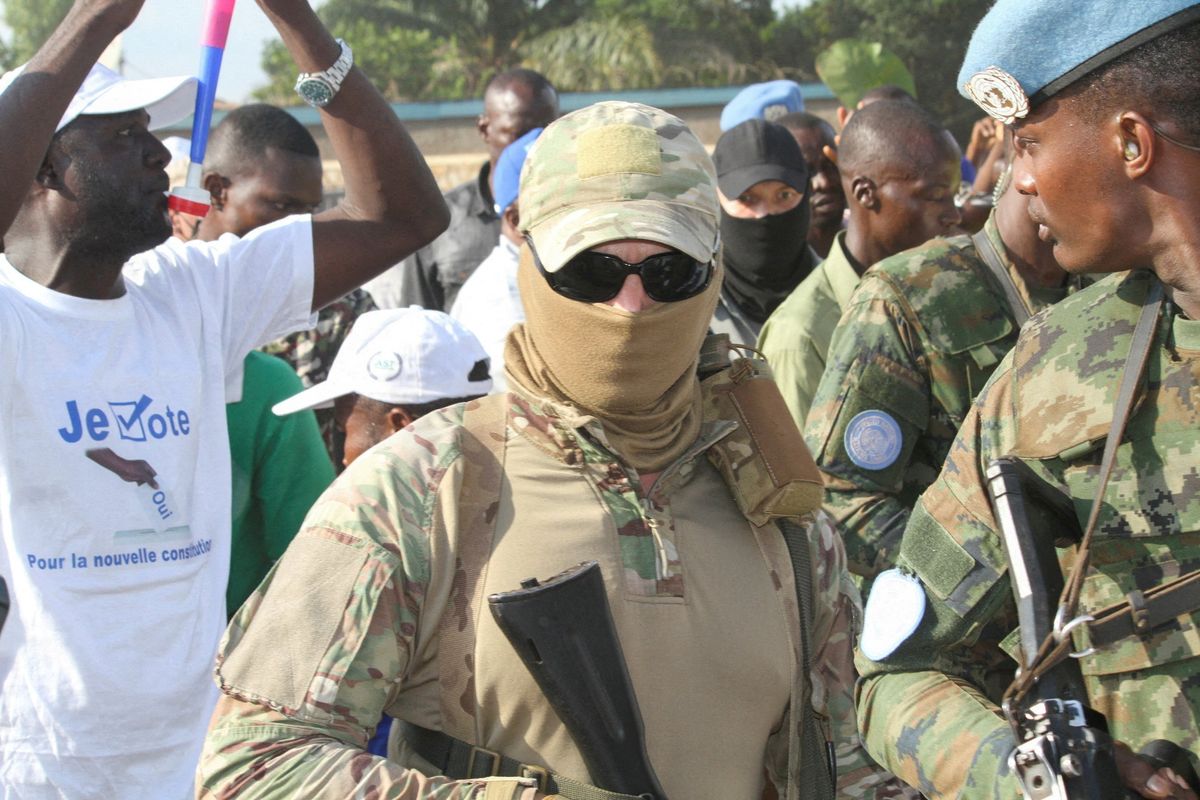 Wagner Group guards are seen around CAR President Faustin-Archange Touadera during the referendum campaign in Bangui.