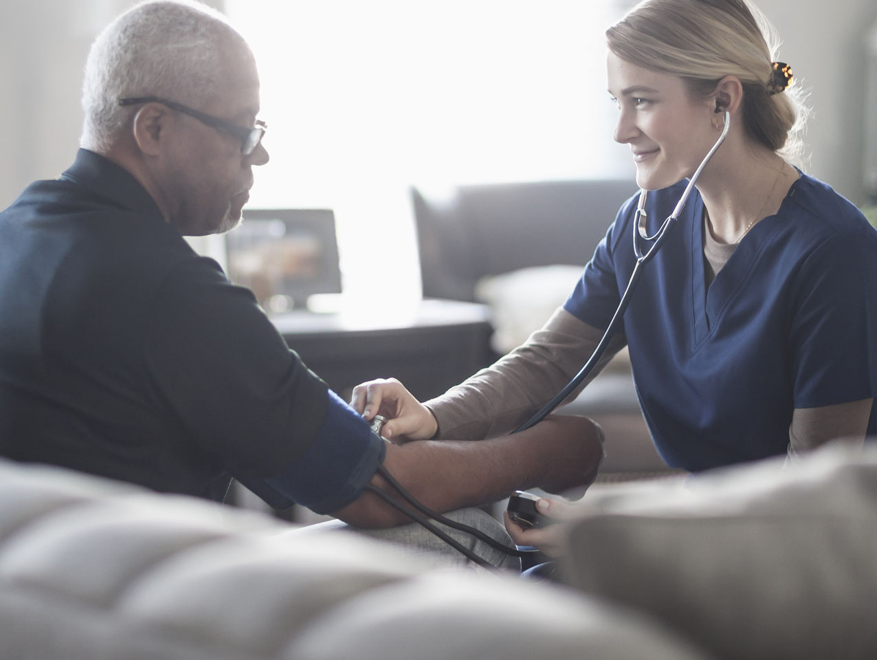 Nurse taking a patient's vitals