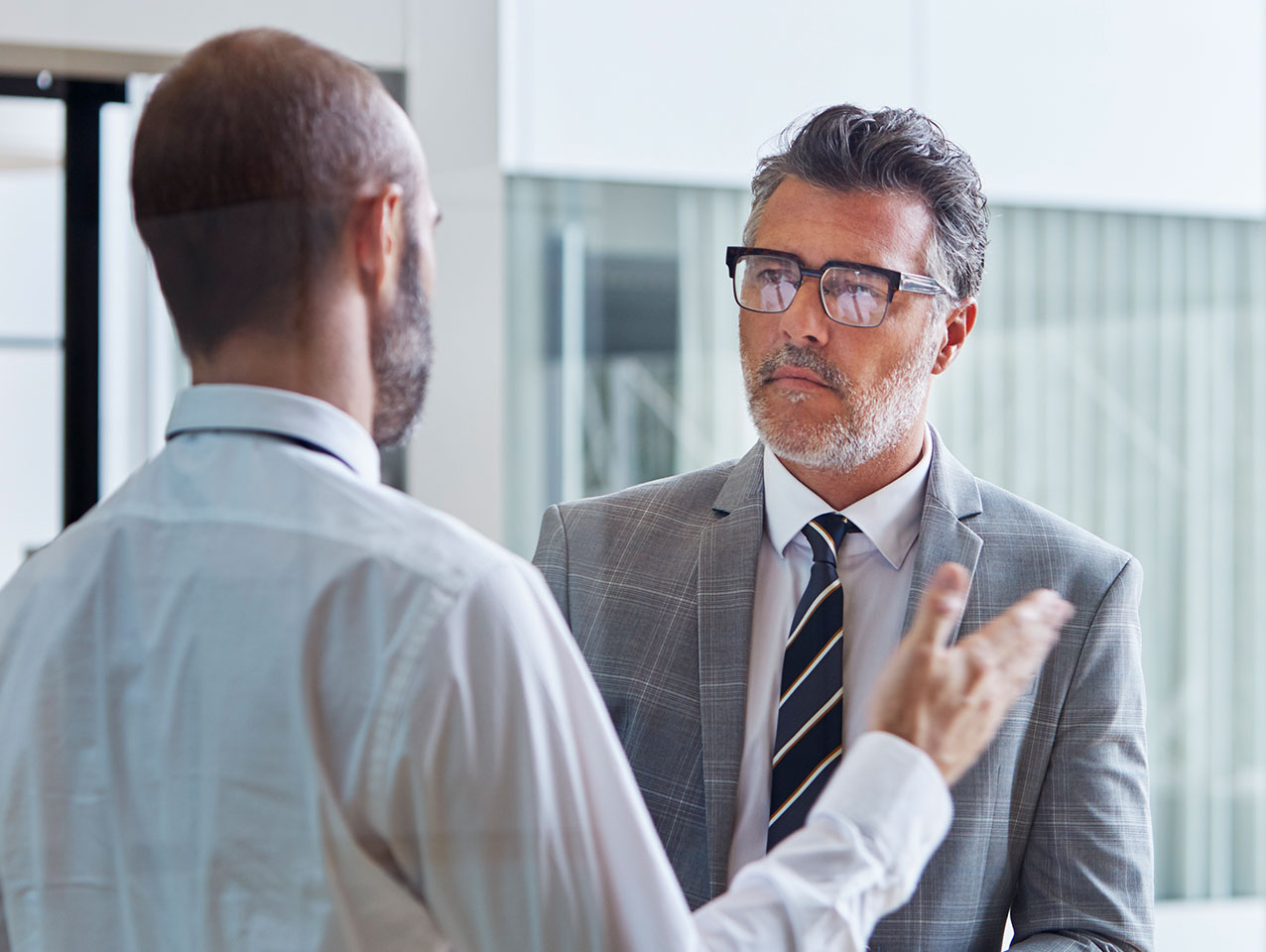 Two men speaking to each other