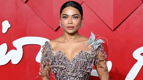 Mona Patel poses on the red carpet at the British Fashion Awards. 