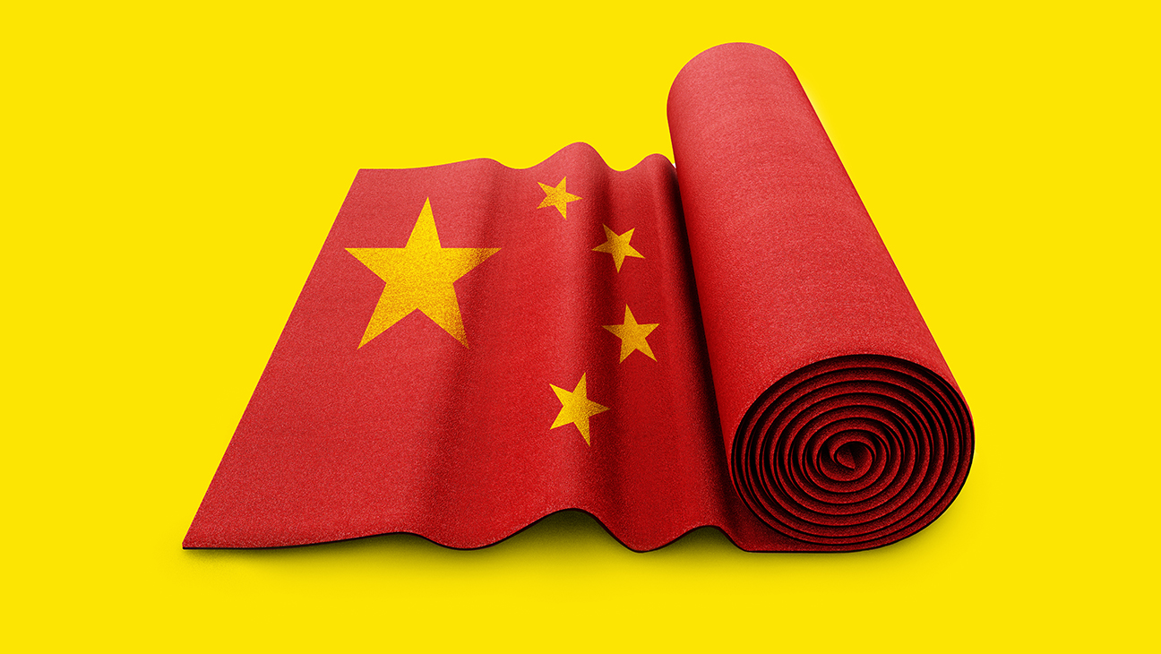 rolled up red carpet with the Chinese flag superimposed on it