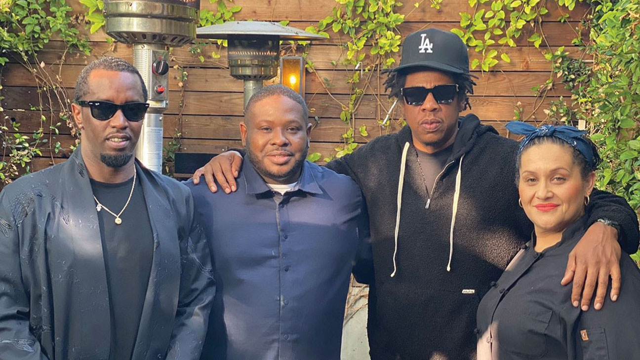 A recent photo from Corbin’s Instagram, captioned: “What Happens when P Diddy ask Jay Z where he can get some #soulfood” From left: Diddy, Corbin, Jay-Z and former Alta Adams sous chef Gwen Etta.