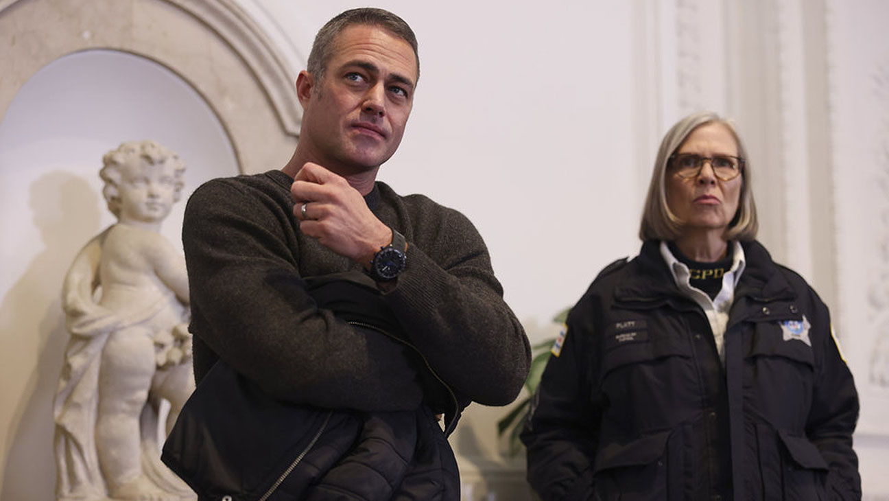 Taylor Kinney as Kelly Severide, Amy Morton as Trudy in Chicago Fire.