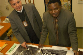 Mr. Chitumbo (right), who heads the IAEA Safeguards Operations Division for the Asia and Pacific region, meets with an IAEA inspector at his IAEA headquarters office. (Credit: Hansen/IAEA)