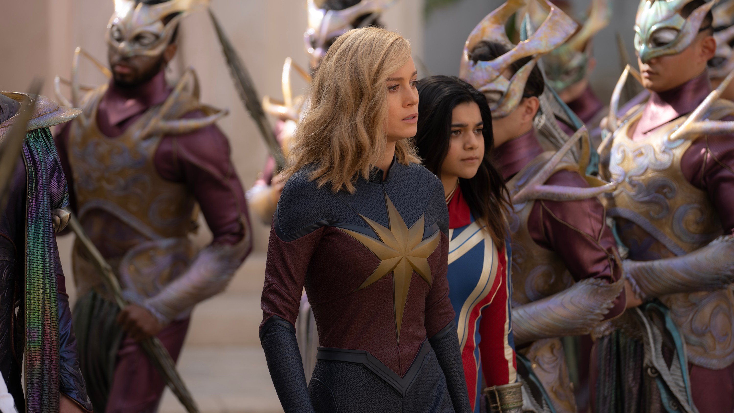 (L-R): Brie Larson as Captain Marvel/Carol Danvers and Iman Vellani as Ms. Marvel/Kamala Khan in Marvel Studios' THE MARVELS. Photo by Laura Radford. © 2023 MARVEL.