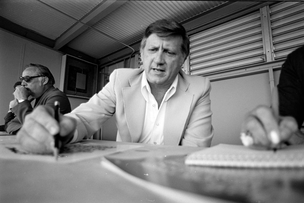 George Steinbrenner (C) watches an exhibition game at Fort Lauderdale Stadium in Fort Lauderdale, Florida, on March 25, 1976. (Photo by Fairchild Archive/WWD/Penske Media via Getty Images)