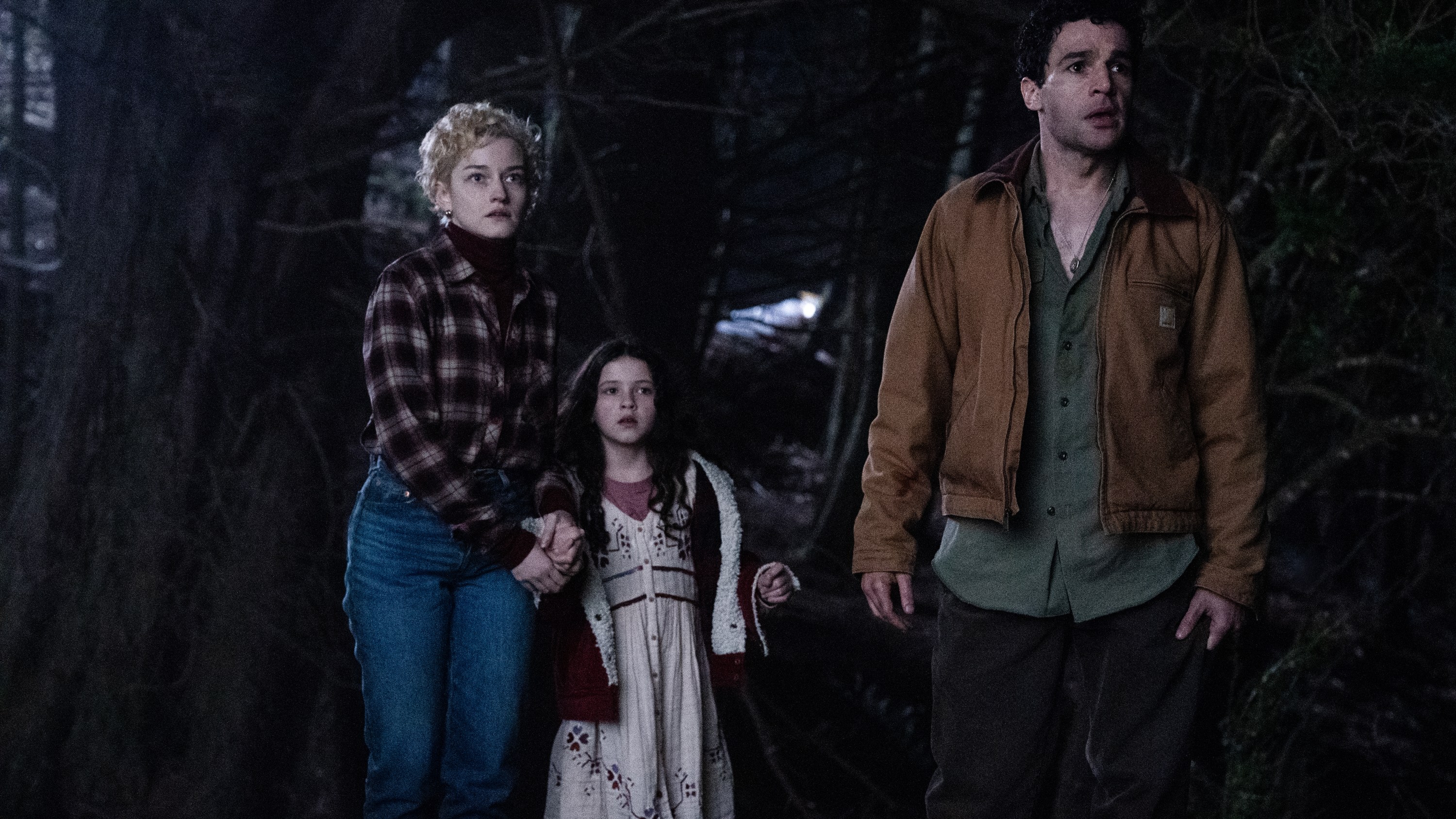 (from left) Charlotte (Julia Garner), Ginger (Matilda Firth) and Blake (Christopher Abbott) in Wolf Man, directed by Leigh Whannell.