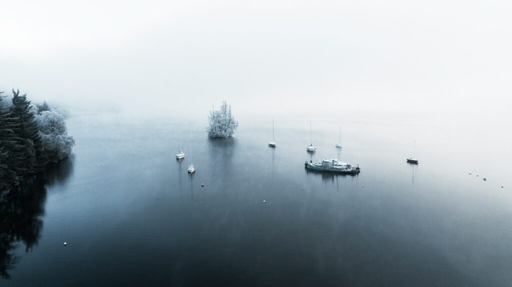 Aerial view of Cherry Island, surrounded by small boats, black and white