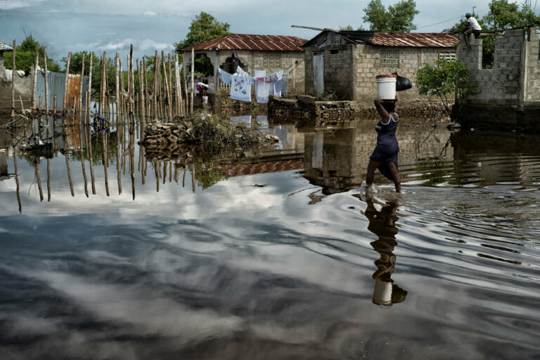 Helping to counteract the sense of 'helplessness' that images of climate impacts can produce, this striking photo tells a positive story of human resilience in the face of adversity.