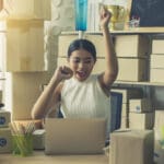 Image of Asian businesspeople working in home office. She is happy and success with their online store. Concept of freelancer startup and online business.