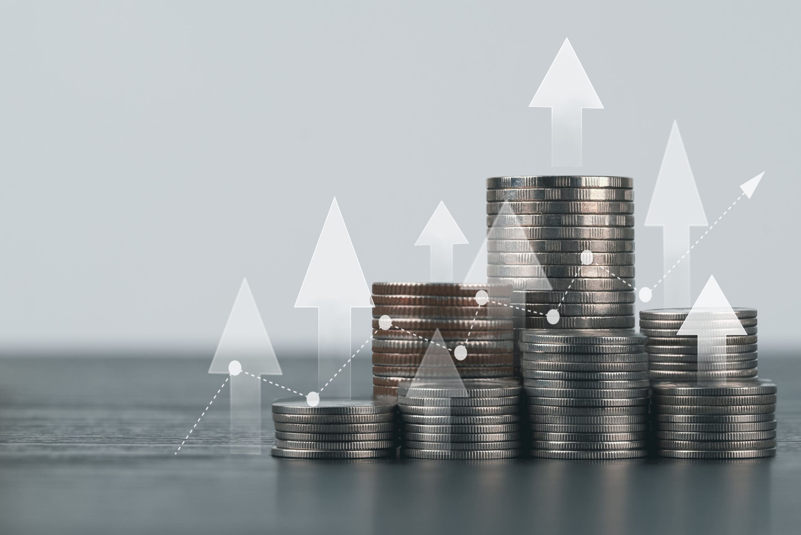 Coin stack with growth chart and graph progress , Market finance and Investments growing with businessman investor , finance and business concept