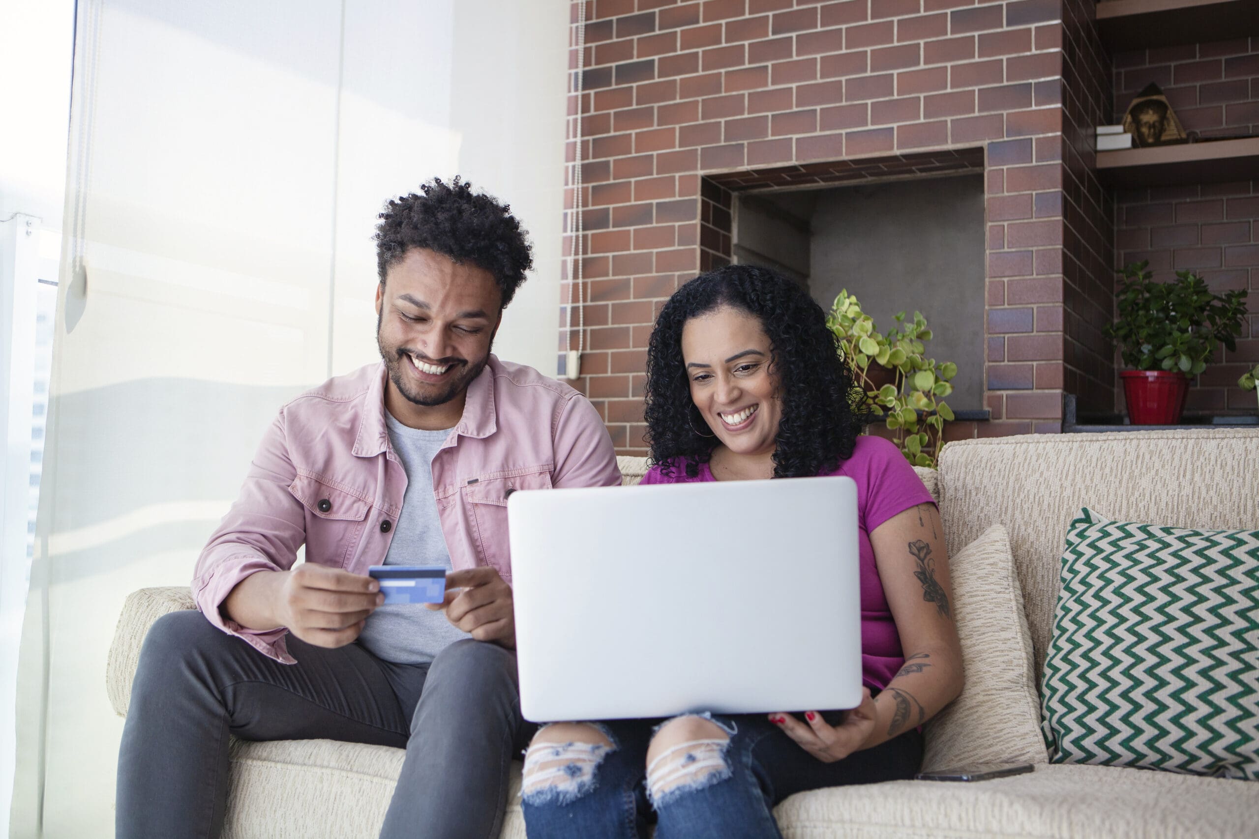 Heterosexual couple shopping online at home