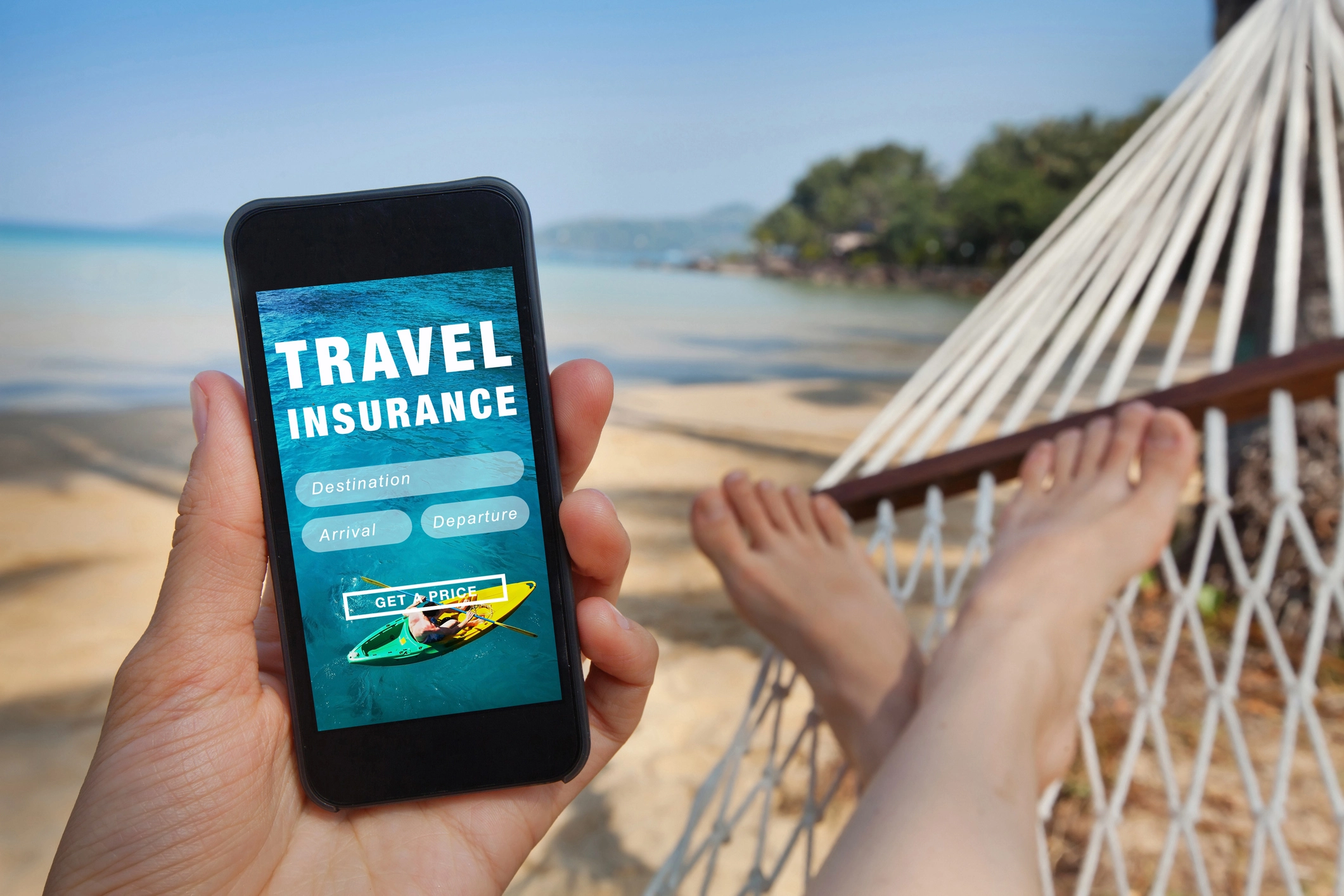 Women Shopping For Travel Insurance On Her Phone Feet Up In Her Hammock