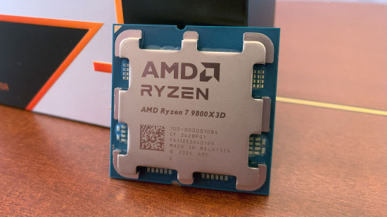 AMD Ryzen 7 9800X3D review: Gaming CPU next to box.