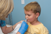 GPs should call in all eligible children for flu vaccine by early December