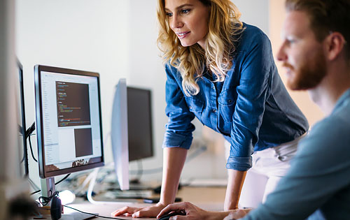 two people looking at the computer