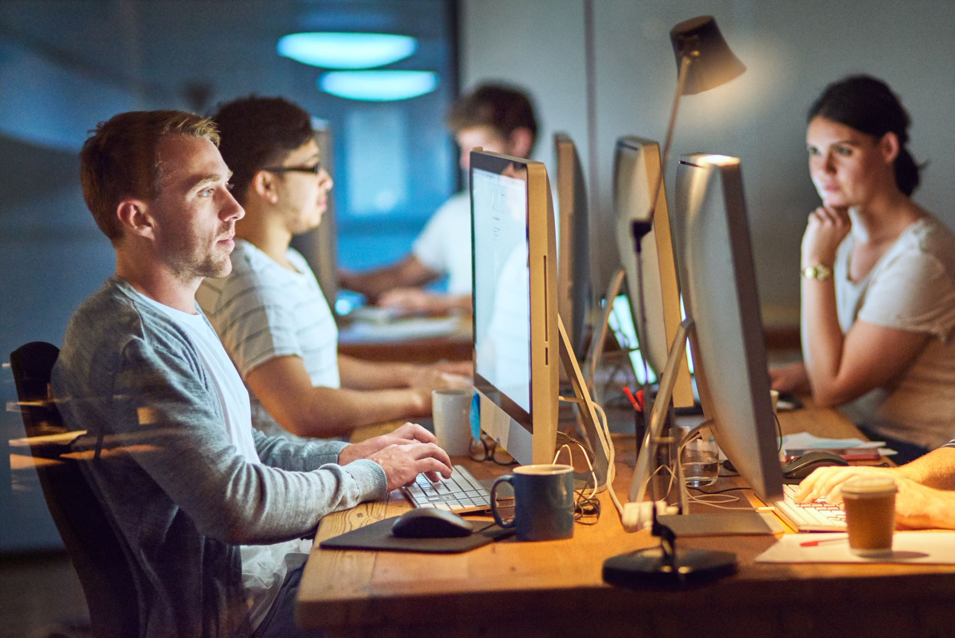 people working in the office at night