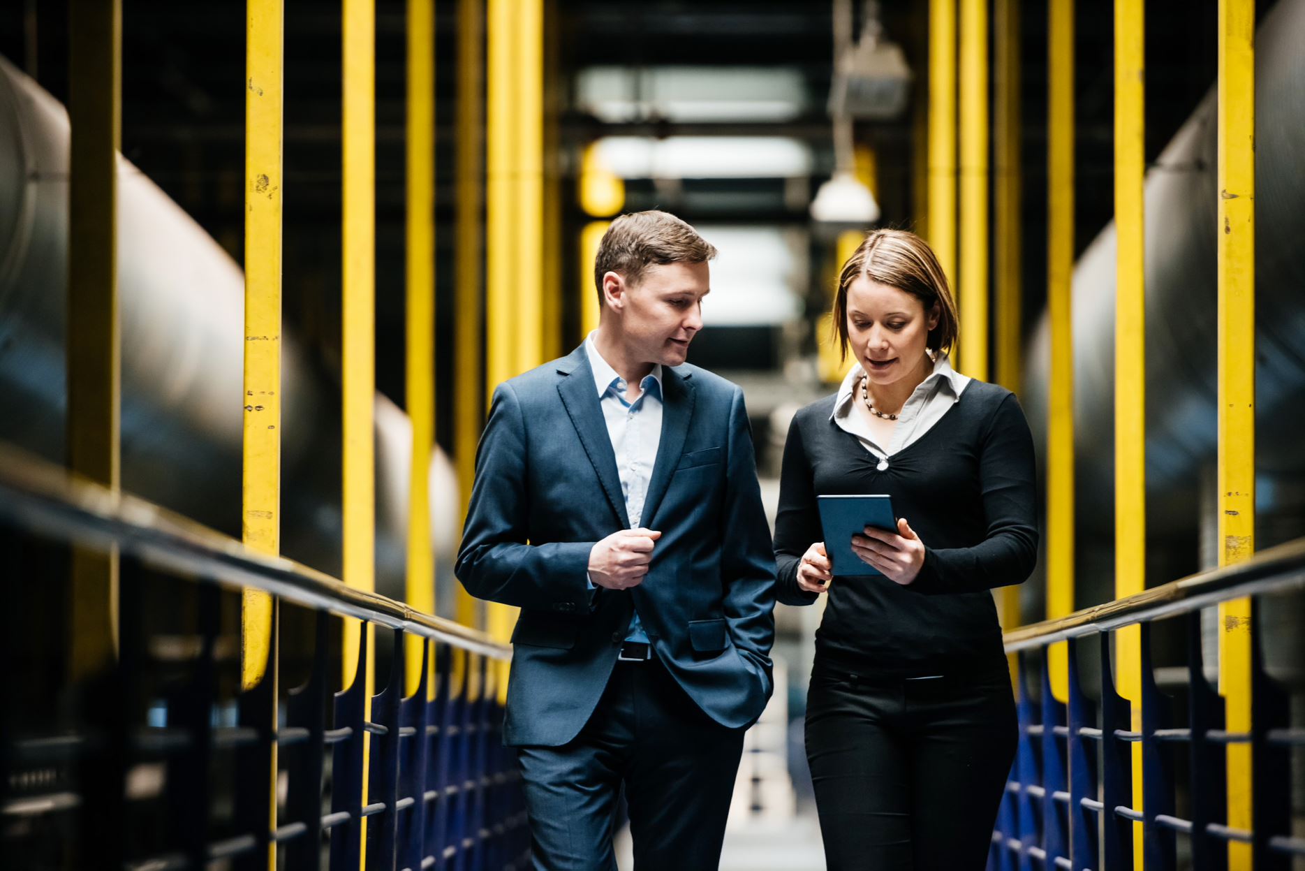 two people in a factory