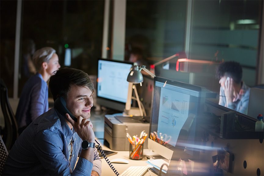 people working in the office at night