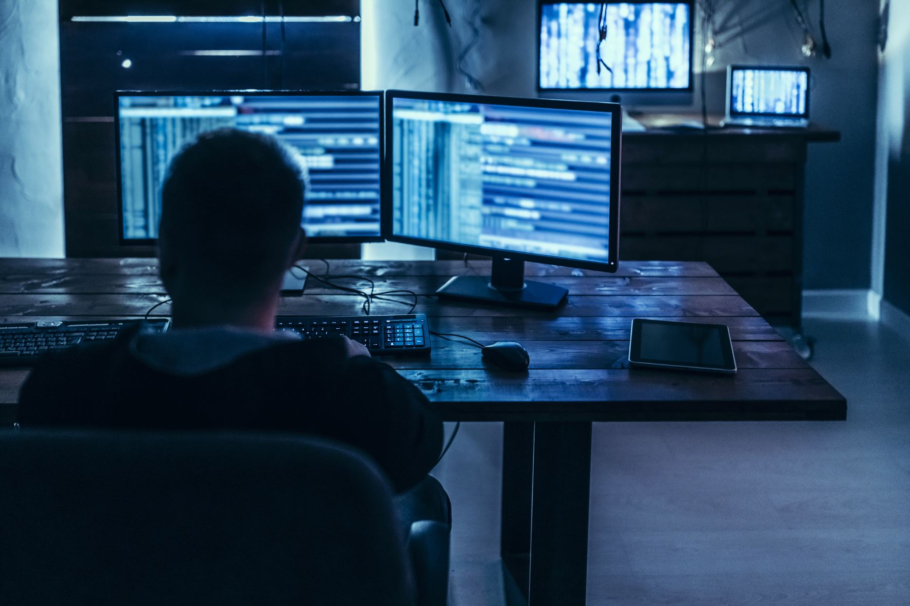 person with two computer screens