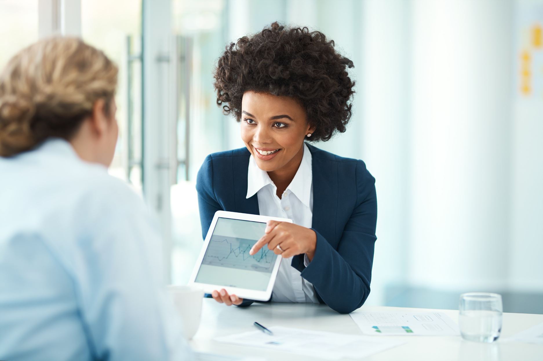 person showing the tablet to the customer