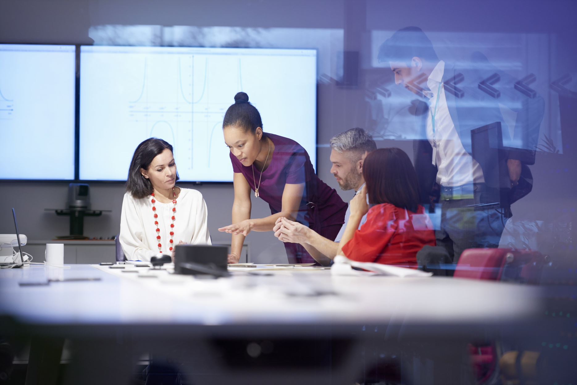 people having a meeting in a room