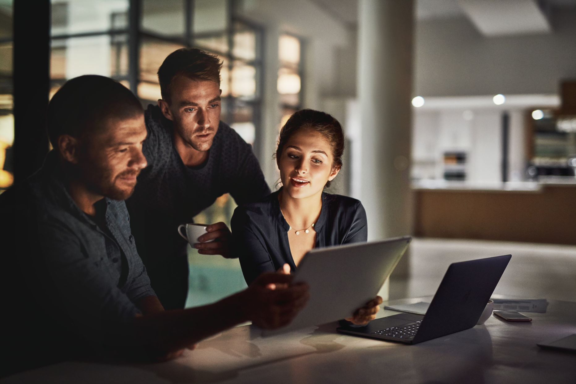 people looking at a laptop