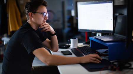 a man looking a computer