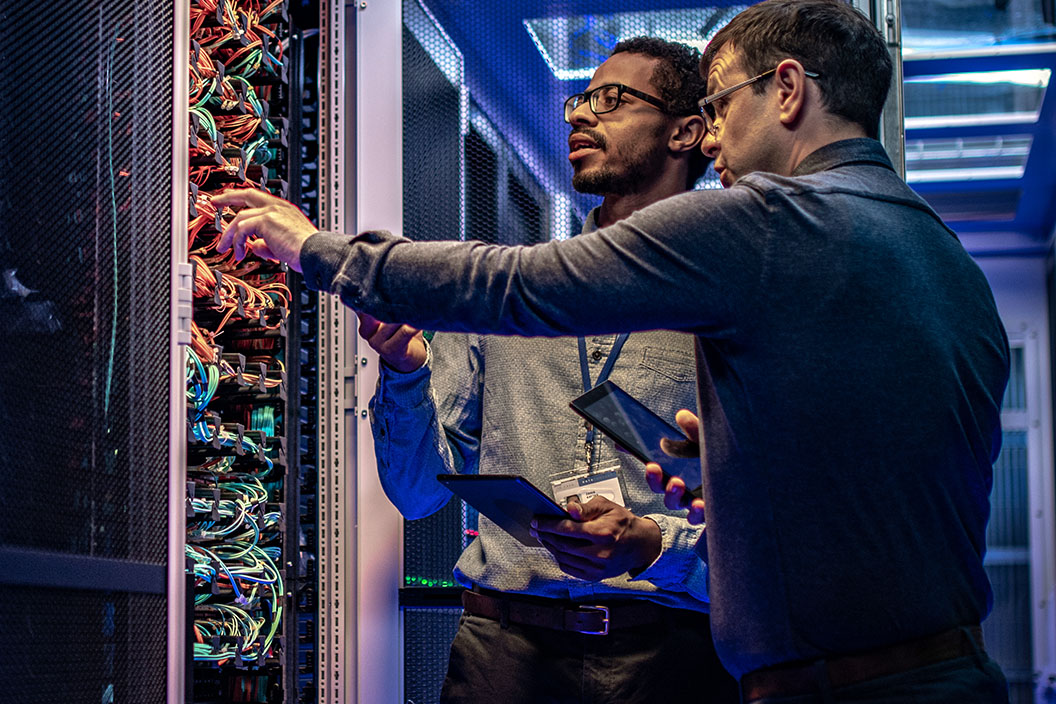 Men working at a data center