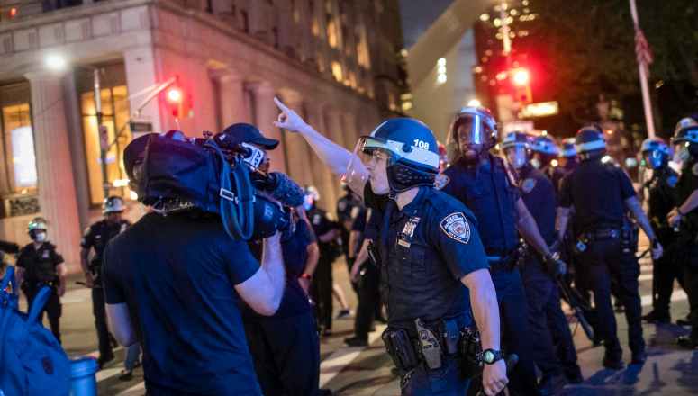 A police officer shouts at Associated Press videojournalist Robert Bumsted, Tuesday, June 2, 2020, in New York. (AP Photo/Wong Maye-E)