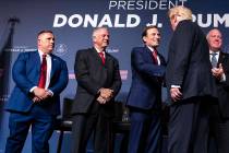 FILE — Former President Donald Trump, right, shakes hand with former Nevada Attorney General ...